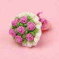 Handmade crochet mini pink rose bouquet with green leaves on soft pink background - Pink Hand Bouquet Doll