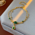 Detail of vintage double-layer gold chain bracelet with malachite stone on jewelry box - Water Drop Malachite Style (TB68)