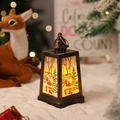 Detail of bronze Christmas lantern with Santa scene and warm yellow LED light - Brushed Gold Santa