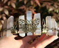 Macro shot of Viking raven skull and bronze butterfly on natural crystal headband - Butterfly Raven Skull Style / Grey Agate/Antique Bronze Wire