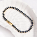 Detail of gold tennis bracelet with dark blue marquise cut stones on a white tray - Royal Blue - Gold