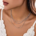 Three-layer silver necklace set with paperclip and snake chains on a model - 3-Layer Paperclip & Snake Bone Chain / Silver (Minimalist Chain)
