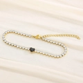 Tennis bracelet in gold finish with a black heart centerpiece and sparkling zircons - Gold Black Stone (KB168994-Z)