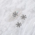 Silver snowflake nail alloy charm with white AB rhinestones on a clear glittery tip - Style A1143-04