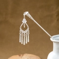 Detail of silver hollowed metal hairpin with elegant flower tassel in a white porcelain vase - Petal Shaped Long Tassel (F376)