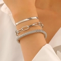 Detail view of silver layered bracelet set including snake chain and paperclip link styles - 24 White Gold WG-0350