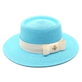 Detail view of sky blue boater hat with cream ribbon and gold bee metal ornament - M (56-58cm) / Lake Blue