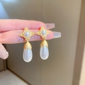 Detailed close-up of vintage style gold drop earrings with white pearls and luxury finish - Vintage Palace Water Drop Pearl (HE11377)