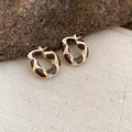 Detail of gold hoop earrings with brown enamel spots and sparkling crystal accents - Leopard Hoop Earrings - Gold - Coffee - Round