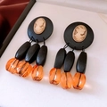 Macro shot of vintage portrait relief earrings with wood beads and amber resin pendants - Retro Cameo Style (Silver Pin-Yellow-Black-Coffee)