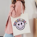 Close-up of spooky vibes Halloween tote bag with leopard print smiley on white canvas - Spooky Vibes (Leopard)