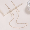 Elegant gold metal eyeglass chain with round beads, imitation pearls and rubber loops - Pearl-Gold