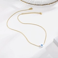 Golden stainless steel necklace with white evil eye pendant and adjustable lobster clasp - Gold