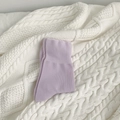 Light purple mid-calf cotton socks with wide ribbed cuffs on a cozy white blanket - Purple