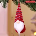 Hanging Christmas gnome with red knitted hat and white beard on a pine tree - Style E