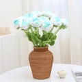 Handmade crocheted rose bouquet in white and light blue yarn presented in wicker vase - Gradient Blue-Green