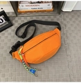 Waterproof orange nylon chest bag with adjustable black strap and blue label detail - Orange + Green Rope