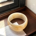 Minimalist wide resin bangle with marble amber texture and smooth polished finish - Milk Yellow