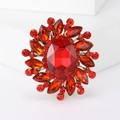 Vintage style brooch with a large red oval crystal and faceted red gemstones - Red