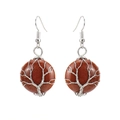 Detailed shot of handmade tree of life earrings with brown goldstone and silver wire wrap - Gold Sandstone