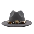 Detail of dark grey fedora hat with double-layered beaded band and vintage metal emblem - Dark Gray