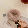 Soft plush hair scrunchie in pastel pink-purple faux fur on an aesthetic magazine - Deep Pink