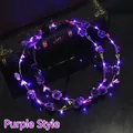 Detail of purple LED flower headband with glowing roses and battery pack on dark background - Purple
