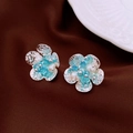Detail of blue crystal flower earrings with white pearl petals on brown silk - Blue White Cluster Flower (10# Silver Earring Post)