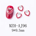 Macro detail of red heart-shaped nail charm with silver base on red manicure surface - Sparkling Full Rhinestone Heart (AJ96)
