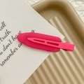 Detail of a matte rose pink seamless duckbill hair clip on a decorative paper card - Neon Rose Pink