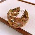 Macro shot of colorful beaded cuff bracelet with bohemian wave design and gold finish - Gold Multi-Color Bead Woven Cuff (27#)