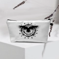 Detail of white waterproof cosmetic bag with Nordic raven compass print on display - Black Mystic Symbols