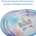 Stack of unicorn party paper plates with floral and star designs for kids birthday events - Purple Unicorn 7 Inch Plates 16pcs