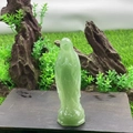 Green semi-precious stone Mary statue carving on wood base with natural moss background - Green Aventurine