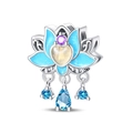 Macro shot of blue enamel lotus charm with purple zircon and teardrop crystal dangles - Color Changing / Blue Lotus Bead
