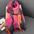 British style pink and orange plaid faux cashmere scarf with fringe on a gray sofa - Rose Red