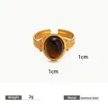 Adjustable stainless steel ring featuring a polished 1cm tiger eye stone, 2g weight - Brown / Gold