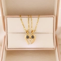 Macro detail of magnetic heart-shaped pendant necklaces for couples in a gift box - Heart Stitching Projection Style (A-1059) / KC Gold