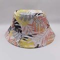 Reversible bucket hat featuring vibrant yellow and pink tropical leaf prints on white canvas - Yellow Pink Black Leaves