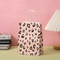 Pink leopard print paper gift bag with white twisted handles on a stylish desktop - Pink Leopard / H21*L15*W8CM