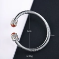 Detailed view of cable twist bangle with aventurine stones and dimension labels - Brown Sandstone / Silver Cable
