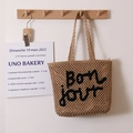Woven straw tote bag with black Bonjour embroidery and a secure zipper closure - Coffee & Black