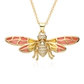 Macro detail of a gold plated bee pendant necklace with colorful enamel wings and zircons - Bee