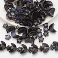 Detailed view of holographic star and moon glass beads with blue-purple glitter finish - Black Multicolor Plated