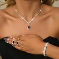 Detail of luxury necklace and earrings set featuring black teardrop zircon stones - Three-Piece Set / Silver Black