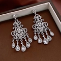 Detailed view of silver bow earrings with long tassels and sparkling zircon stones - Baroque Water Drop Pendant (37#)