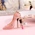 Detailed view of pink high heel keychain with lipstick charm and white pearl pendant - Lipstick Pearl Pink