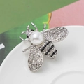 Sparkling silver bee brooch with white pearl inlay and crystal wings for women - Style 28