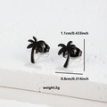 Macro shot of black stainless steel coconut tree earrings on textured white stone - Palm Tree (075) / Black