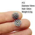 Close-up of 10mm flower spacer bead in gunmetal alloy for DIY jewelry crafting - 12#